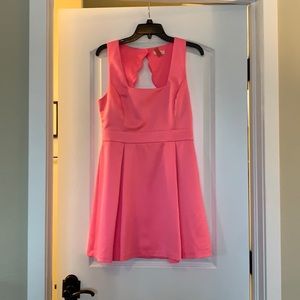 Hot pink dress with scalloped open back and bow